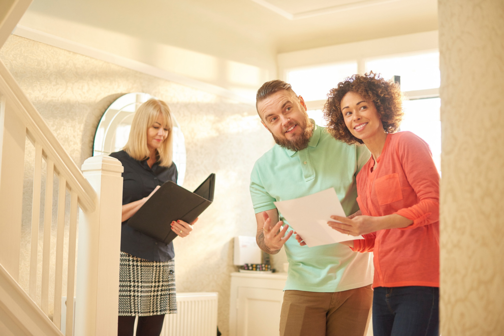 Las Vegas homeowners reviewing their home listing with a real estate agent