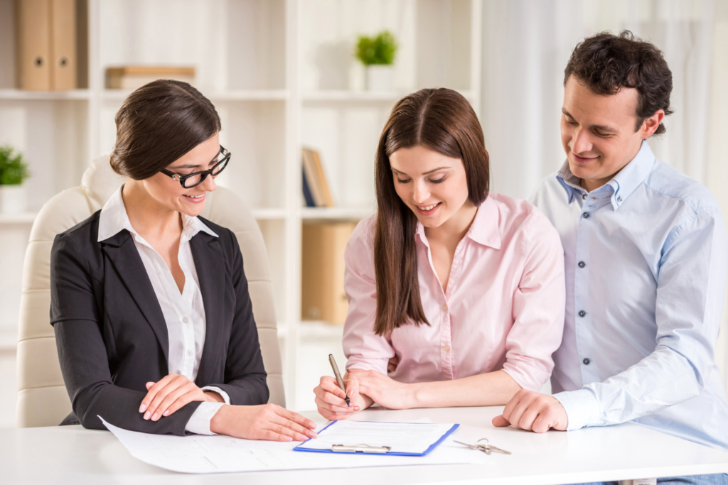 Home buyers signing closing documents in Las Vegas