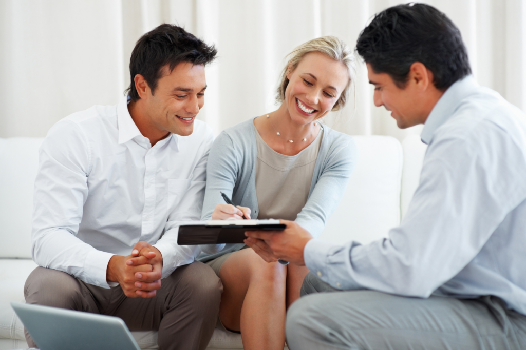 Buyer reviewing earnest money and home purchase documents with real estate agent