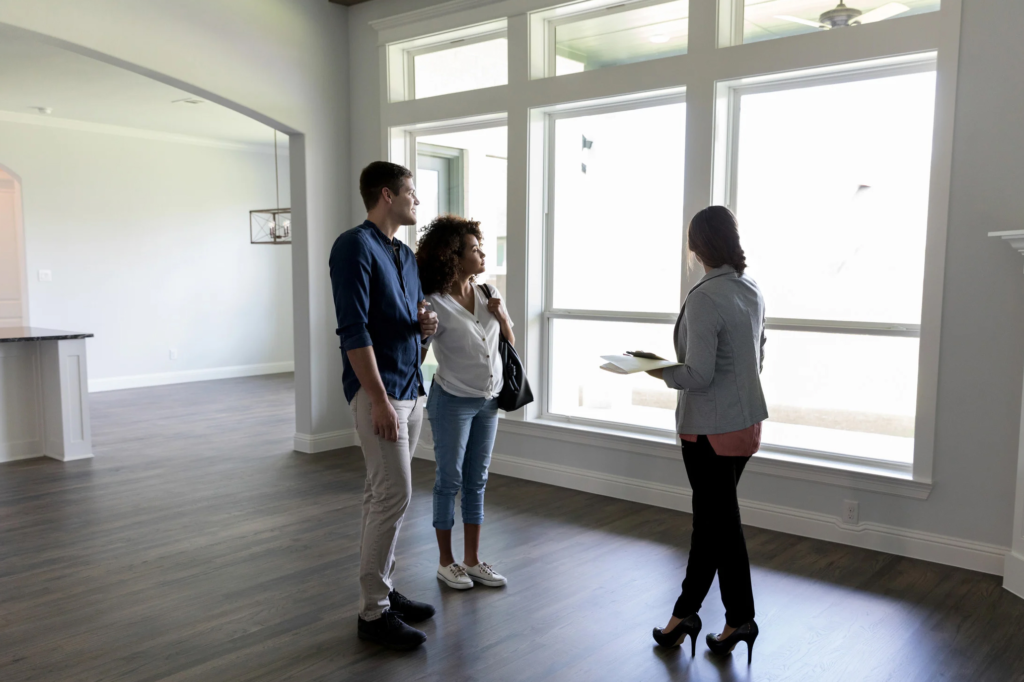 Home buyers completing a final walkthrough before closing on a house